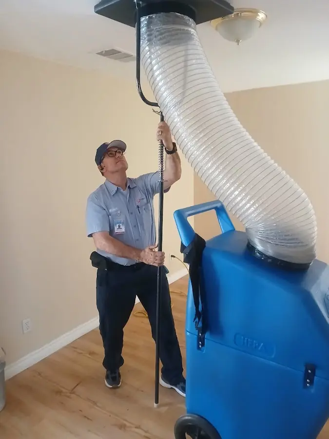 Furnace Tune-Up technician using HEPA equipment in South San Francisco